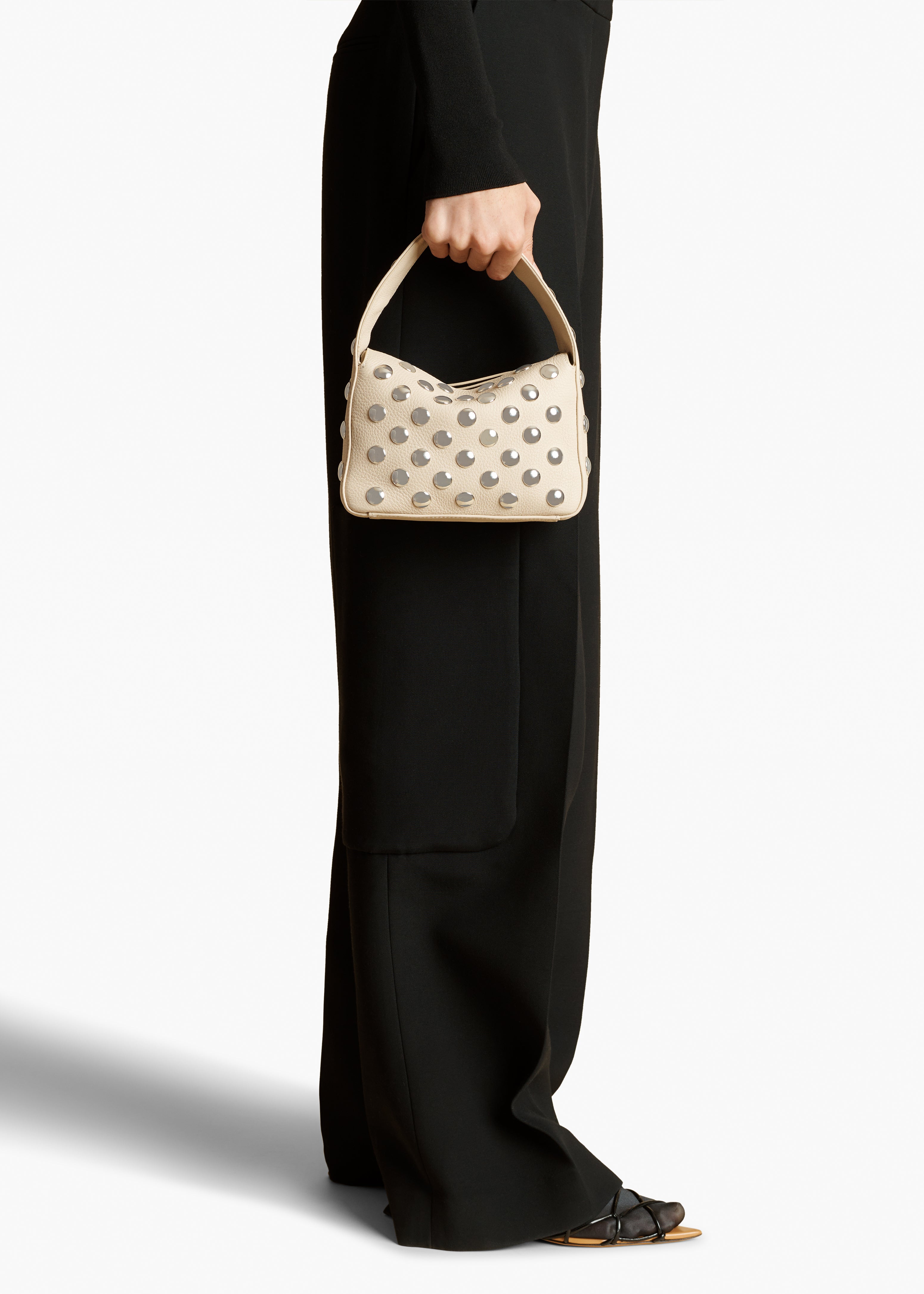 SMALL ELENA HANDBAG IN PEBBLED DARK IVORY WITH STUDS STYLED VIEW