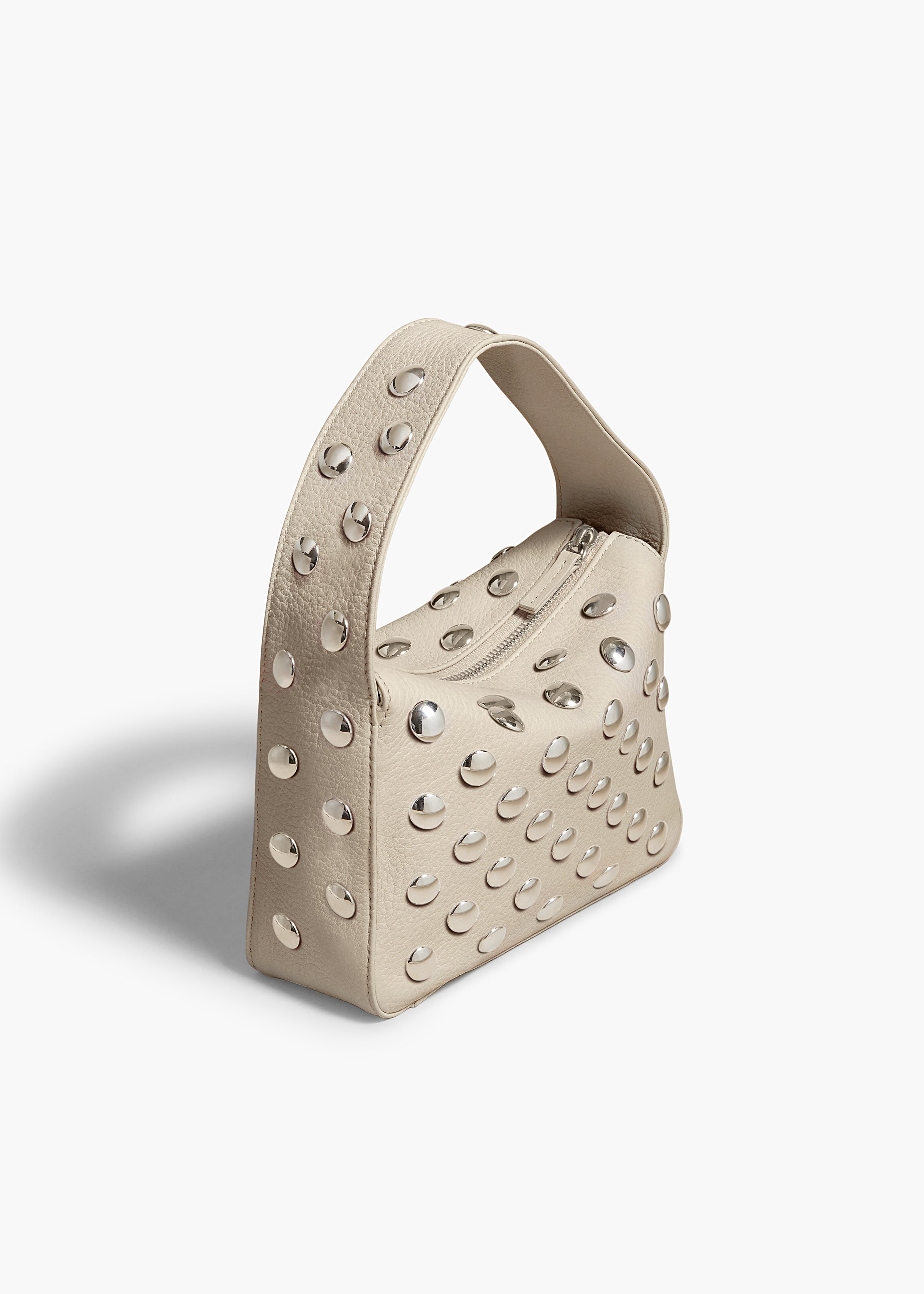 SMALL ELENA HANDBAG IN PEBBLED DARK IVORY WITH STUDS ANGLED VIEW