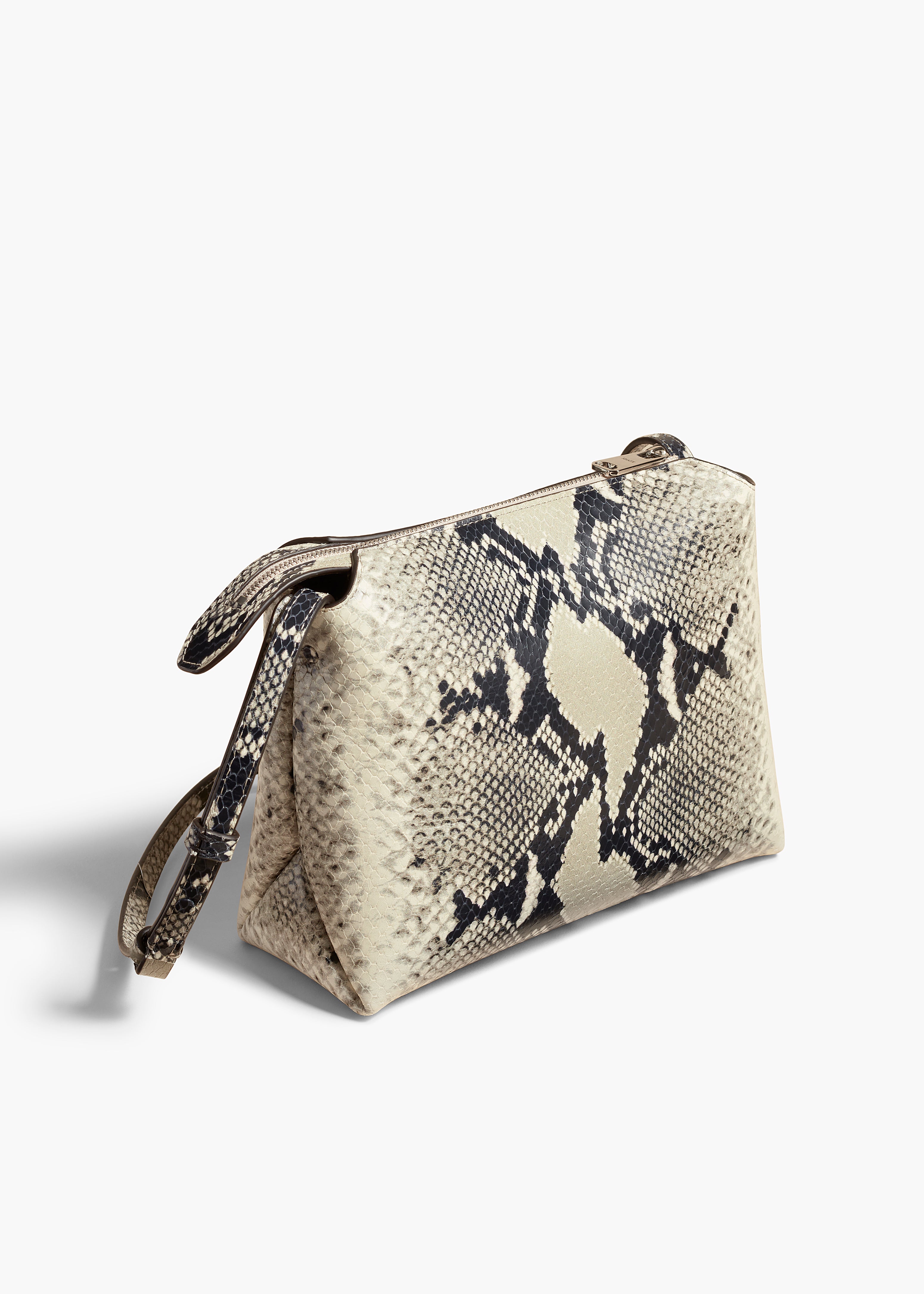 LINA MEDIUM CROSSBODY IN NATURAL PYTHON ANGLED VIEW