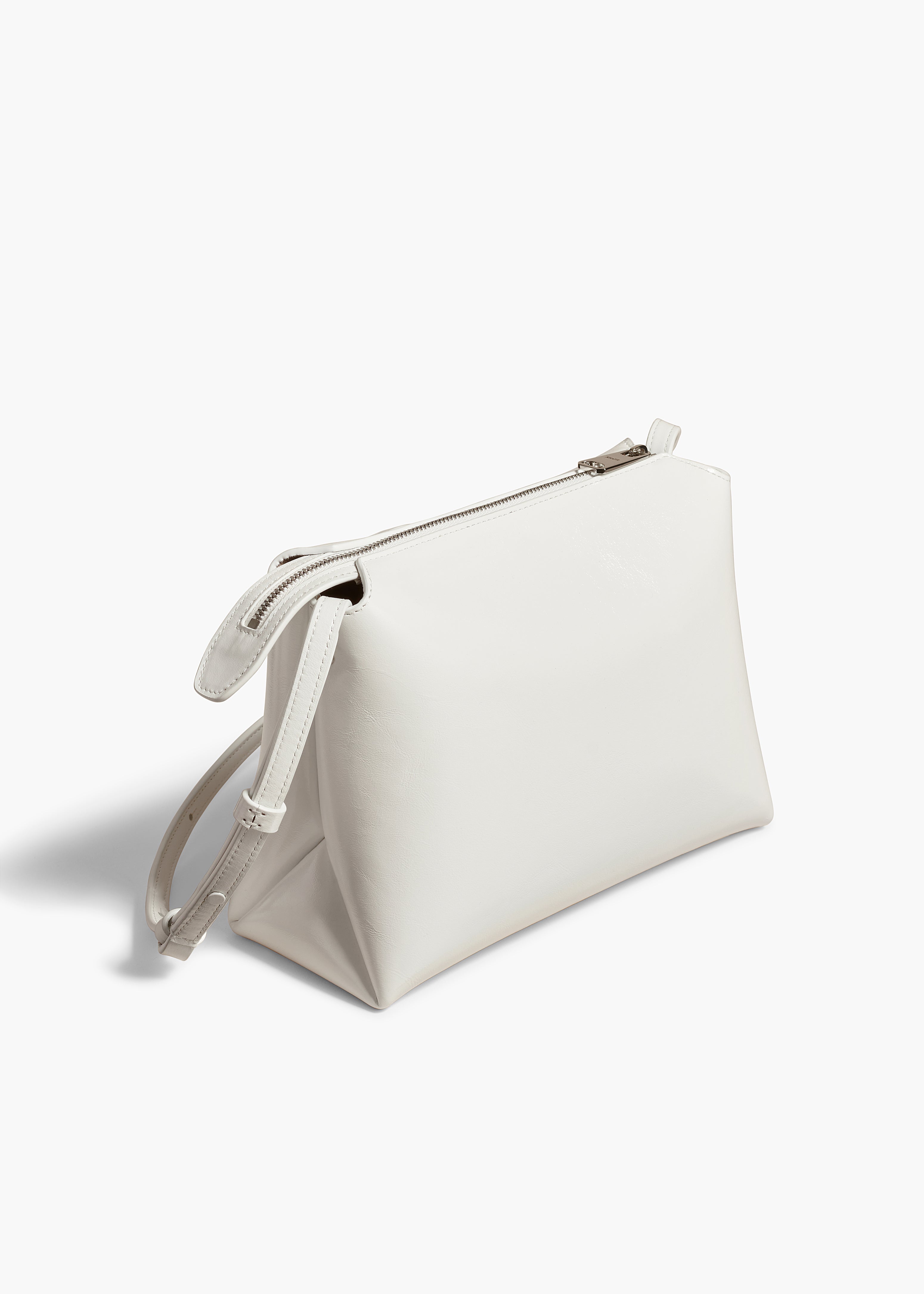 LINA MEDIUM CROSSBODY IN OPTIC WHITE CRACKLE PATENT LEATHER ANGLED VIEW