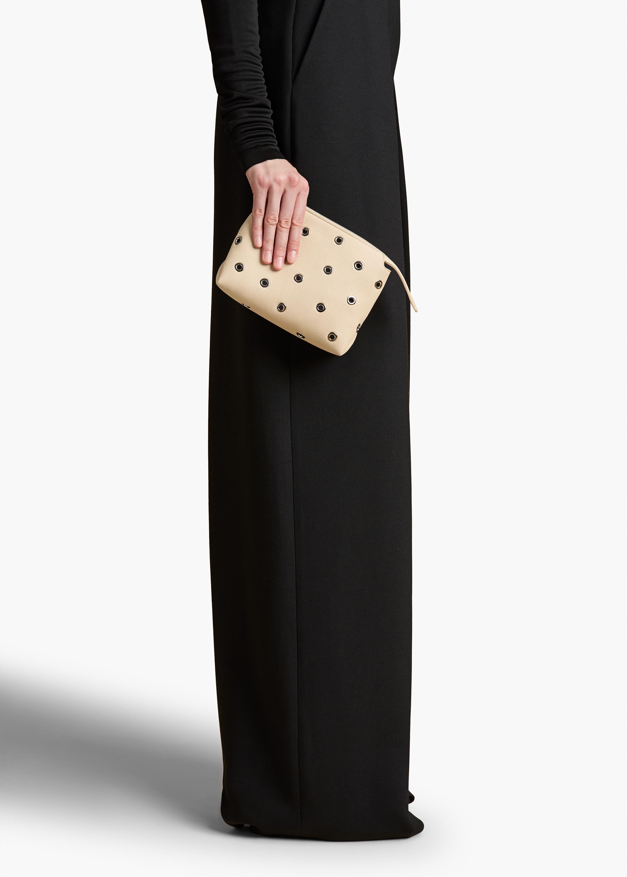 Lina Pochette in Dark Ivory Pebbled Leather with Grommets ON FIGURE