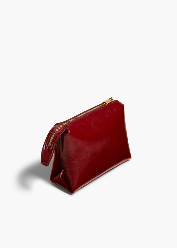 LINA SMALL POUCHETTE IN OXBLOOD CRACKLE PATENT LEATHER ANGLED VIEW