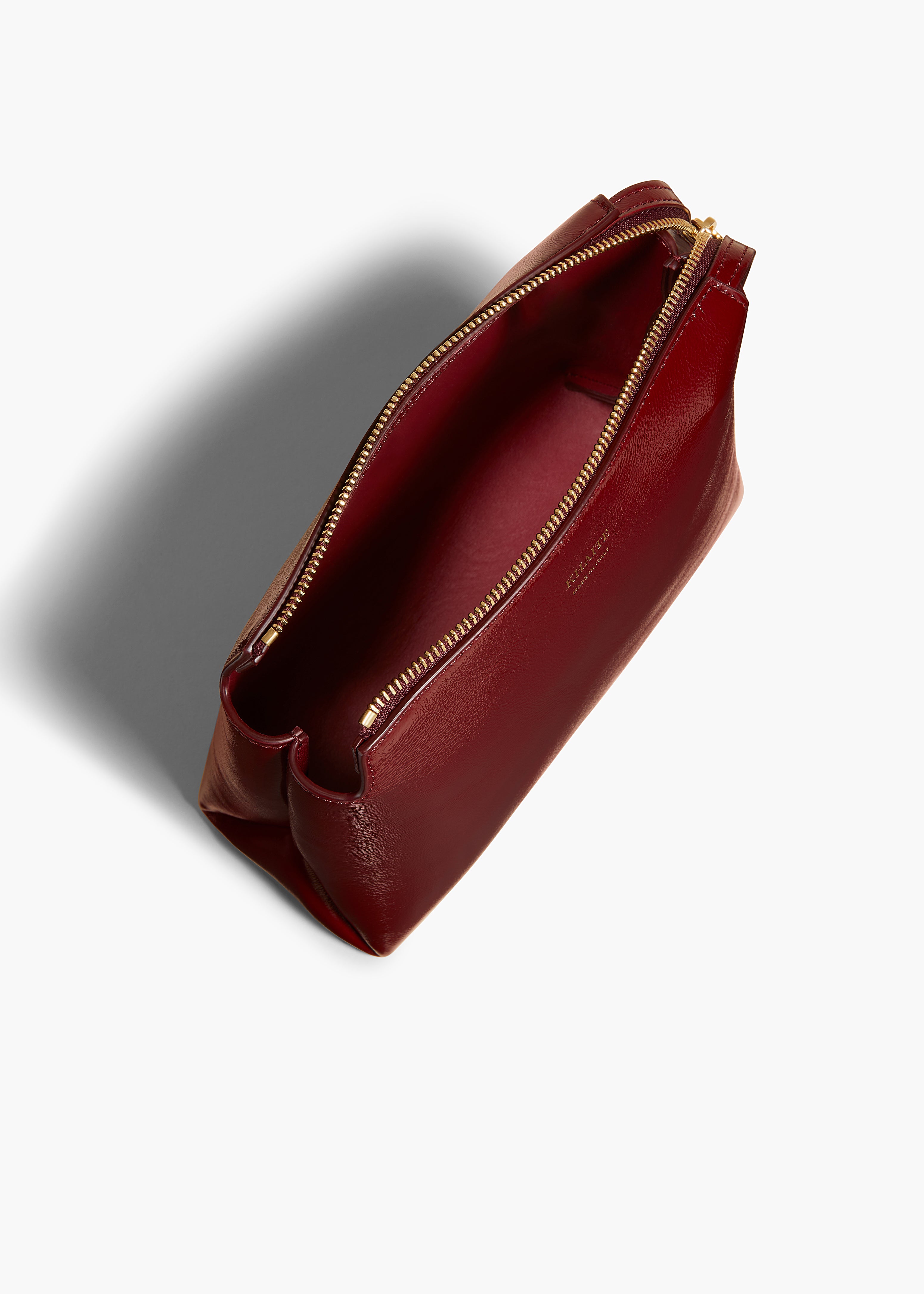 LINA SMALL POUCHETTE IN OXBLOOD CRACKLE PATENT LEATHER OVERHEAD VIEW