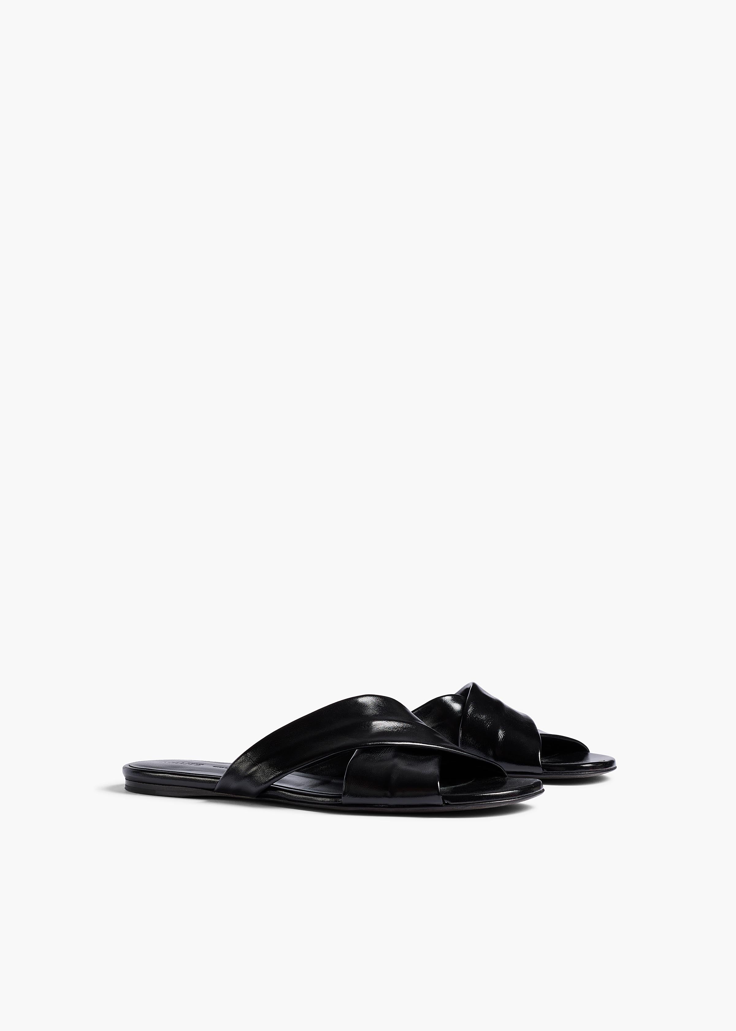 Liria Flat Sandal in Black Glazed Leather