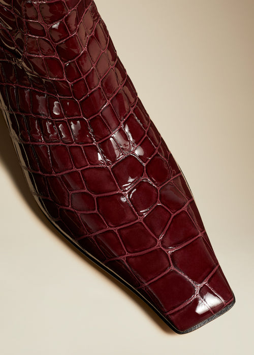 The Marfa Knee-High Boot in Bordeaux Croc-Embossed Leather