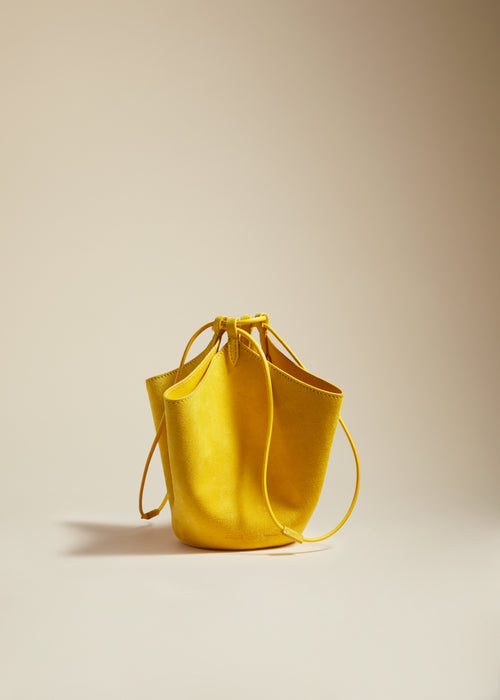 The Mini Lotus Drawstring Bag in Lemon Suede